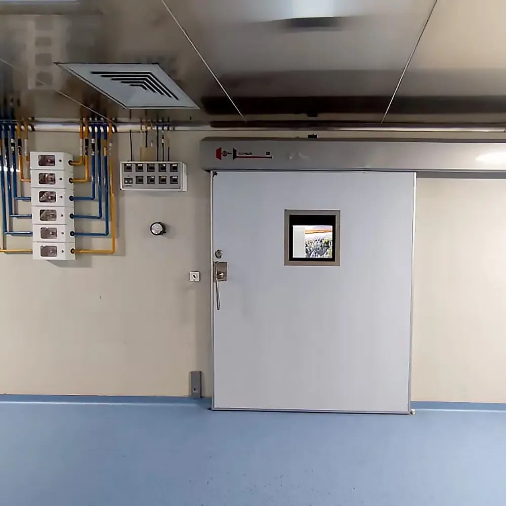Hermetically sealed sliding door and control panel outside an operating theatre